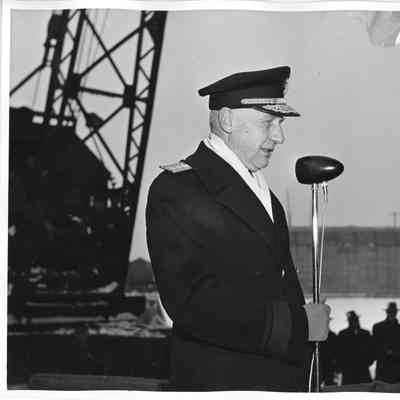 Rear Admiral William C. Watts speaking at ceremony