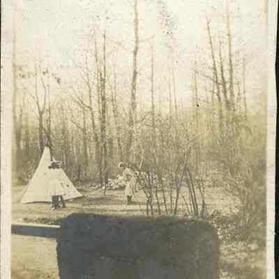 Children with toy teepee
