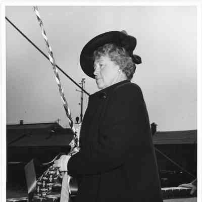 Mrs. William E. Wagener Holding christening bottle