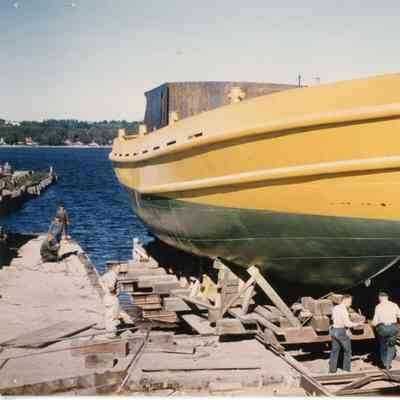 Green and yellow boat in a cradle