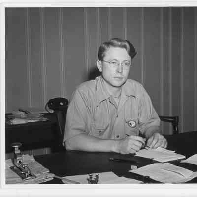 Unidentified man sitting at desk at L.D. Smith Office July 29, 1942