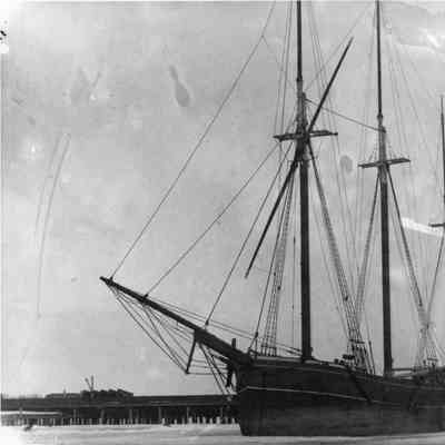 Three-masted schooner with sails down