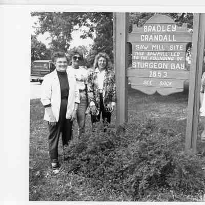 sign at sunset park with 6 people 1993
