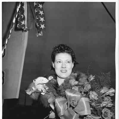 Mrs. E. A. Washburn holding roses