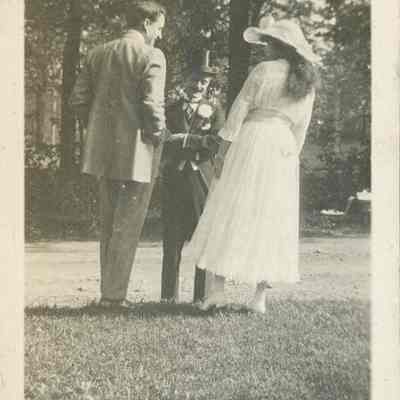 three people in yard