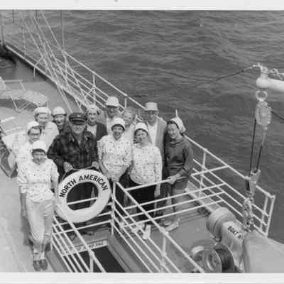 People posing on SS North American June 1956