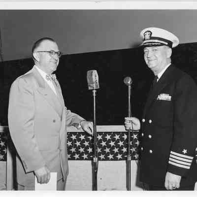 C. Ray Christianson and naval officer at launching of LST-1170 May 22, 1954