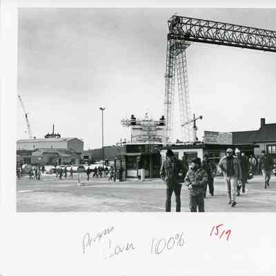 Group of people walking at Bay Shipbuilding parking lot