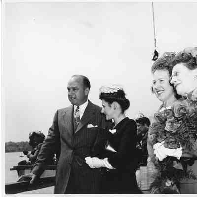 Karl Reynolds, Mrs. Robert L. Rote and Alva Smith at christening of AK-205 USS Poinsett