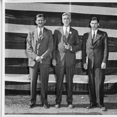 Three unidentified men at M Awards