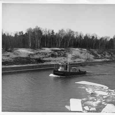 US Engineer Department tug underway in canal in winter