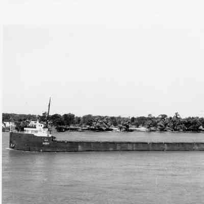 Steamship Elba underway with trees in background
