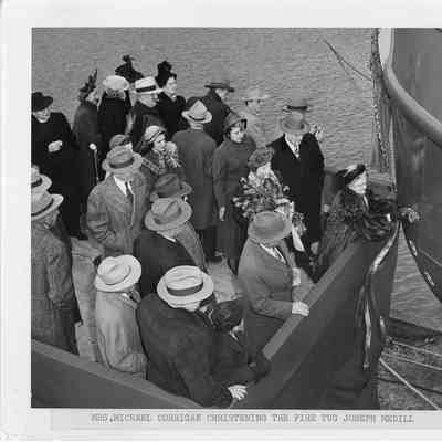 25 people on platform during the christening of the Joseph Medill 1949