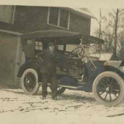 Man poses with car