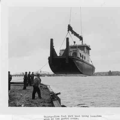 35' work boat being launched via gantry crane Christy Corp 1948