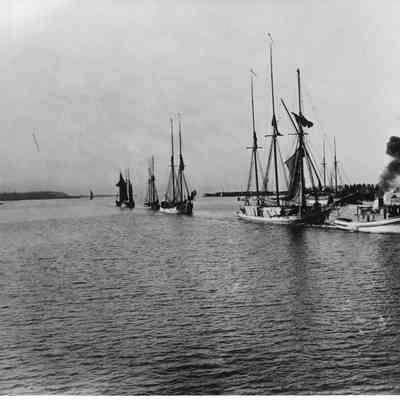five vessels being towed in Sturgeon Bay, WI