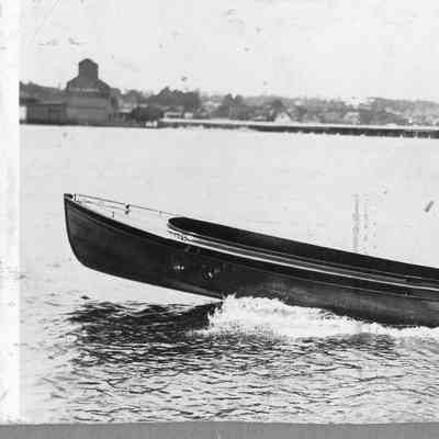 Man on runabout underway with outboard motor running