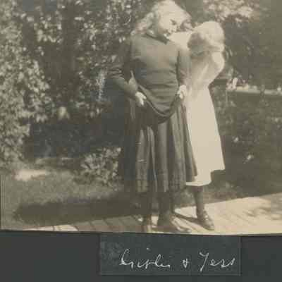 Young girl and woman on wooden walkway