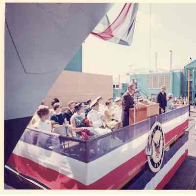 Man at podium during christening ceremony of PG 93 Welch