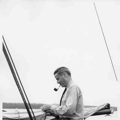Don Fries pipe in mouth standing aboard the Half Moon