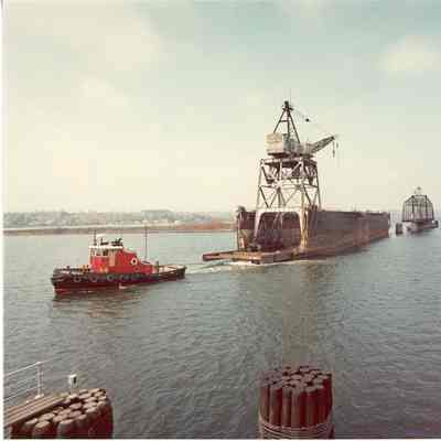 Christy Corp gantry crane on barge being towed by tug Chas Asher