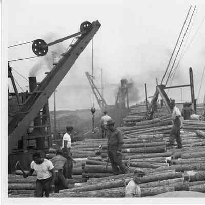 Men on vessel with a load of lumber