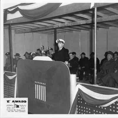man giving speech during Army/Navy E award April 20, 1944