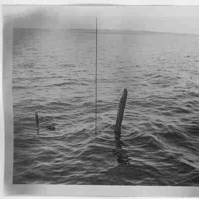 Half Moon being raised with mast above water
