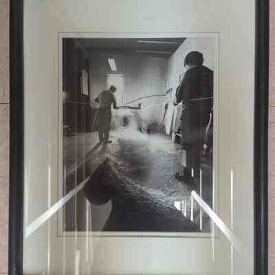 Framed photograph of fisherman stringing big mesh