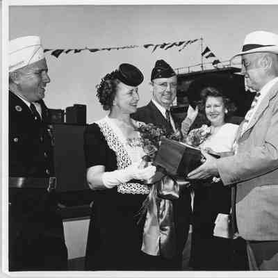 L.D. Smith handing sponsor box to Mrs. Lawrence H. Smith