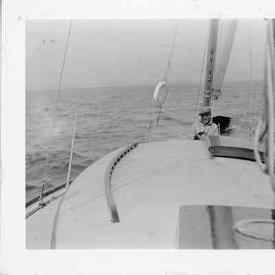 Man sitting on bow of Adventure
