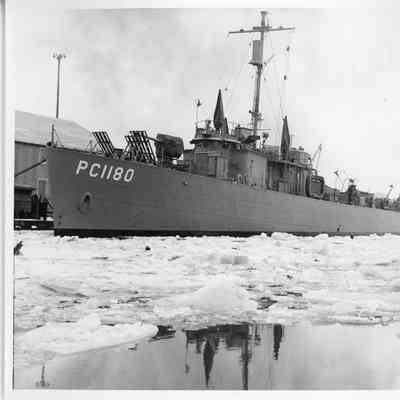 PC-1180 followed by PC-822 and tug John Roen in icy waters 1943