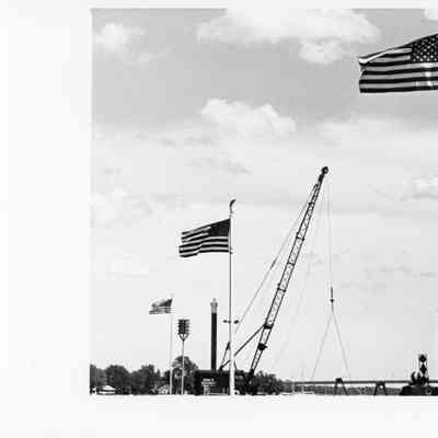 3 American flags flying with Roen Salvage Crane 1993