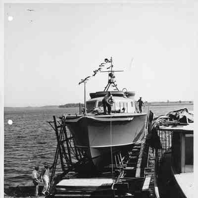 Man standing on deck of P-572 in cradle at Peterson Boat Works August 8, 1944