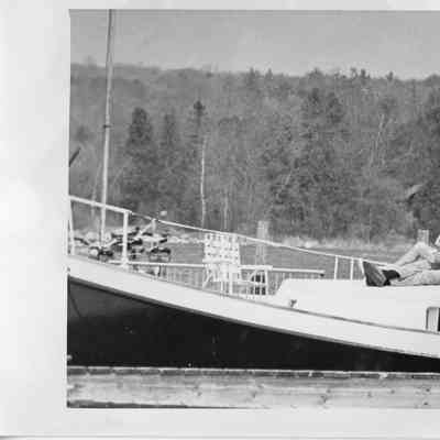 older couple relaxing on front of boat