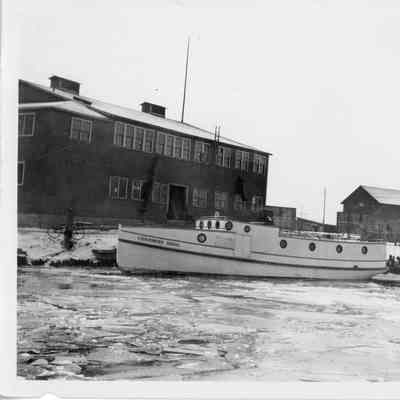 Chambers Bros fishing tug dockside in icy water