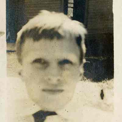 boy in front of building