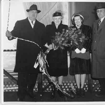 L.D. Smith and Alva Smith with ship sponsor at christening of K-215 Tipton