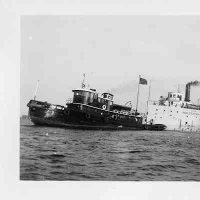 John Roen III towing barge Hilda loaded with logs
