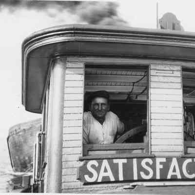 Two people in pilot house of Satisfaction