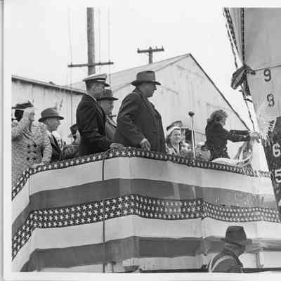 Woman christening PC-588 at Leathem D. Smith Shipbuilding Co.