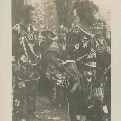 Native American in regalia as part of ceremonial performance in DePere