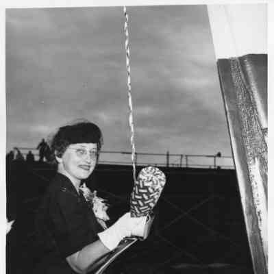 Mrs. John butterweck holding Champagne bottle containing milk