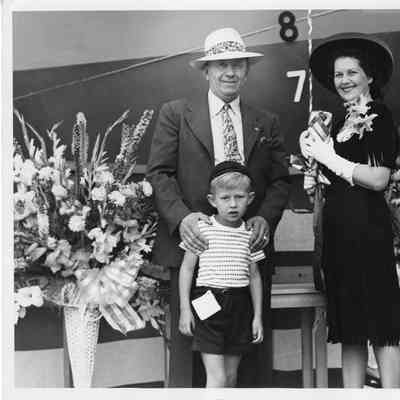 Captain and Mrs. John Roen with son at launch