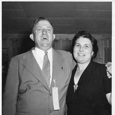 C. Ray Christianson with arm around wife