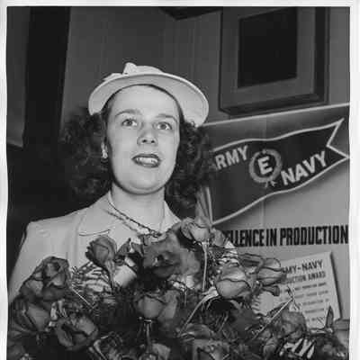 Miss Ann Duffy holding roses