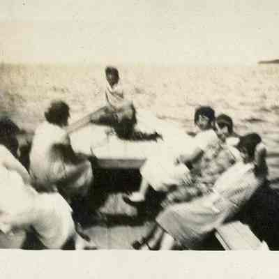 Group of people riding pound boat 1925