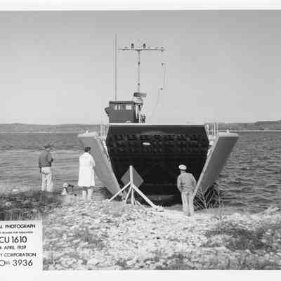 LCU-1610 at shore with stern end opening April 24, 1959