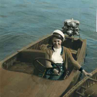Woman in pleasure boat with Outboard motor 1941