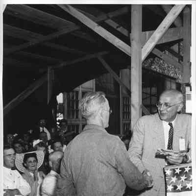 Unidentified L.D. Smith employee shaking hands with speaker